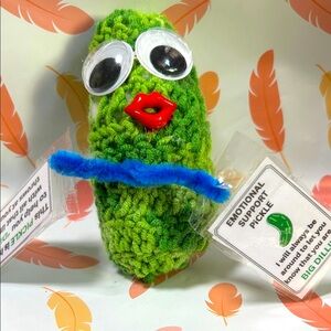 Green handmade crocheted Pickle Plush with Googly Eyes